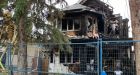 Edmonton neighbourhood on edge over notes asking for payment after house fire