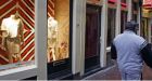 Hand bags replace hookers in Dutch red-light district