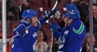 Canucks top 100-point plateau with win over Wild