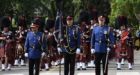 Funeral procession for slain Edmonton officer underway as thousands line streets.
